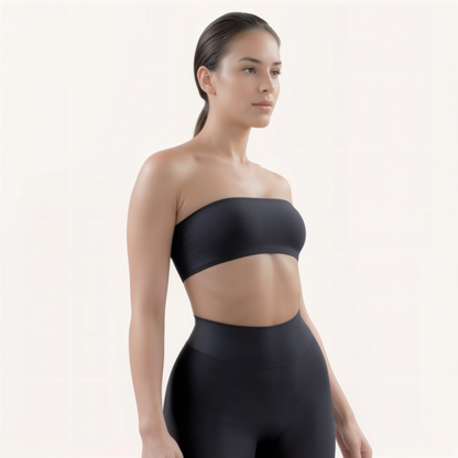 Chicletics Elite Bandeau Bra in black, seamless strapless design, shown on a model with smooth fabric and minimal support features.