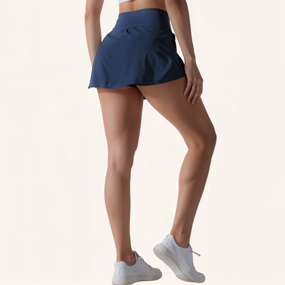 Chicletics Vital Active Skort shown with a navy blue athletic skirt and built-in shorts, designed for active wear and comfort.