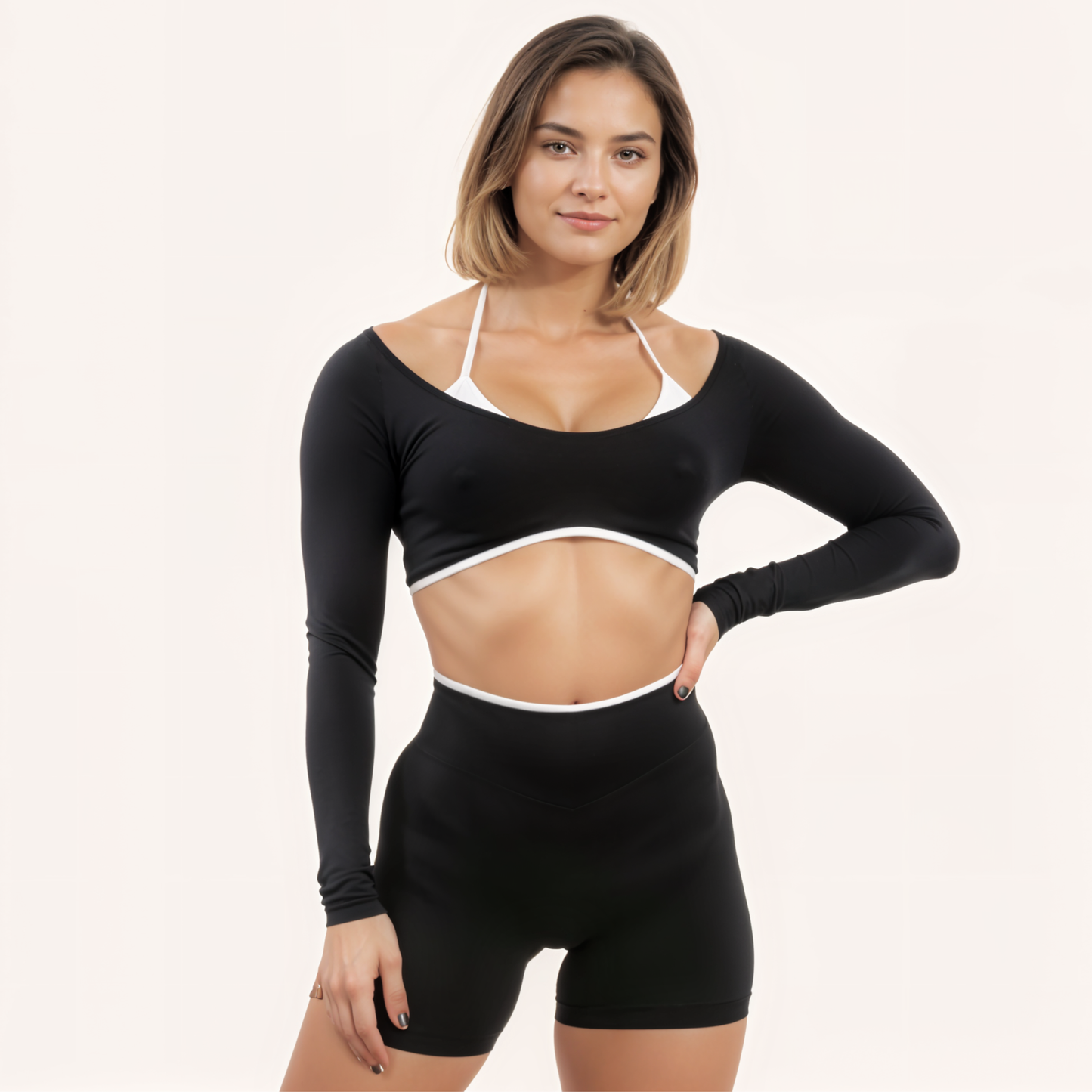 Chicletics Edge long sleeve shirt in black, fitted design with crew neckline, displayed on a mannequin.