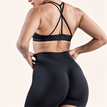 Chicletics Elite Crossback Bra shown in black with supportive straps and smooth fabric, designed for active wear and comfort