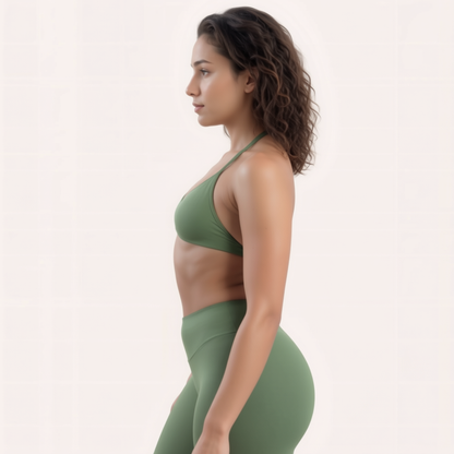 Chicletics Apex Strappy Bra featuring adjustable straps and supportive design, shown on a model in a neutral setting.