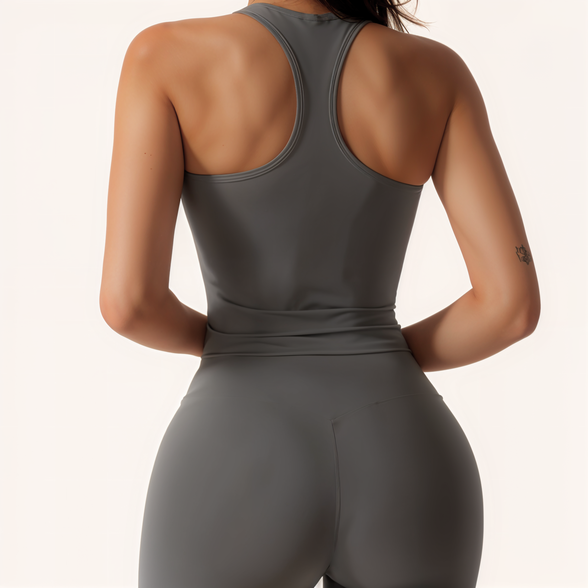 Chicletics Vitality Top displayed on a hanger, featuring a stylish, fitted design with short sleeves and vibrant color details.