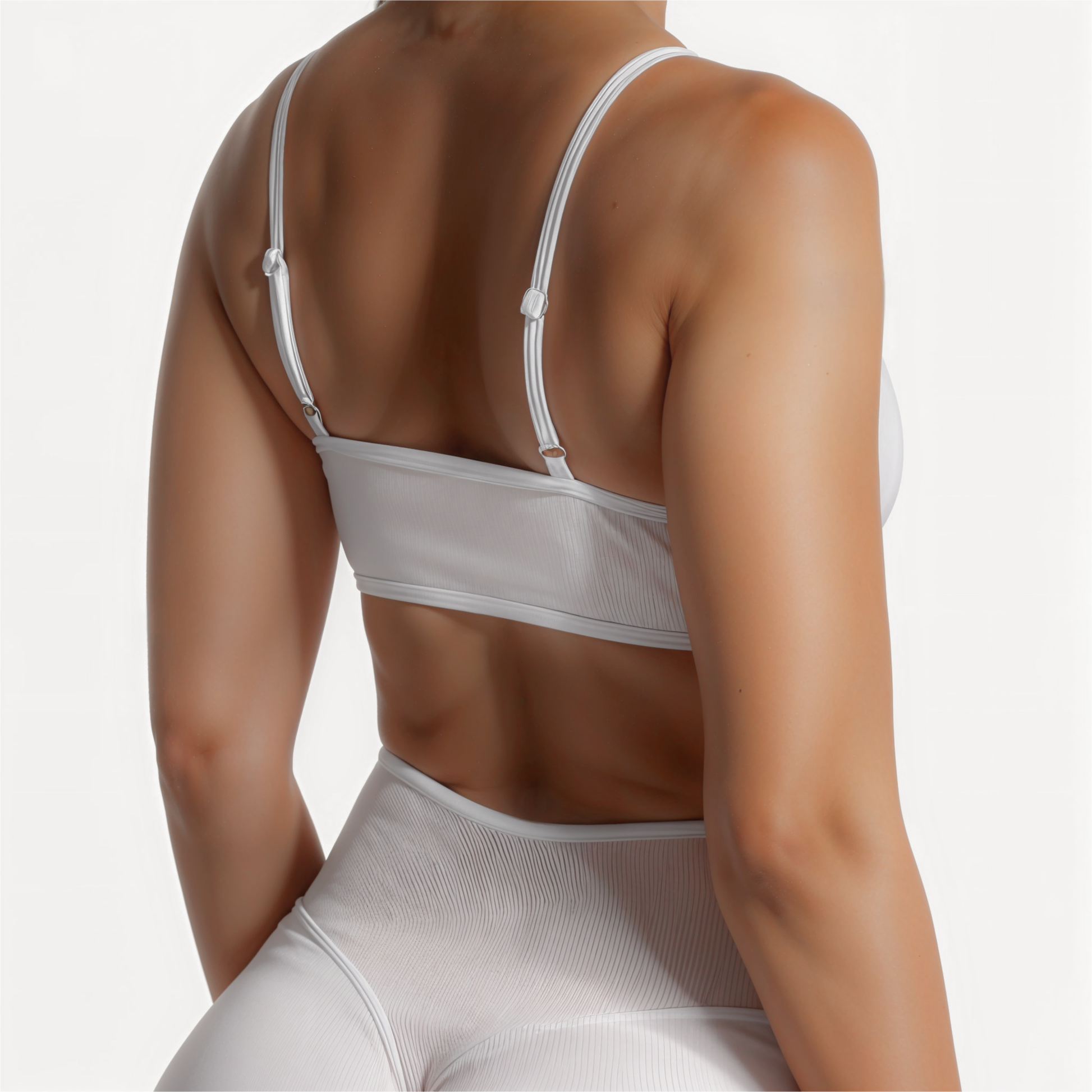 Chicletics Edge Backless Bra shown on a model, featuring seamless design and adhesive cups for a backless, strapless support.